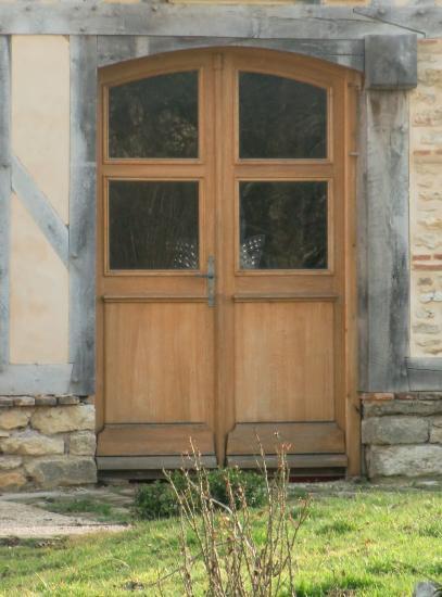 PORTE D'ENTREE DOUBLE A CINTRE SURBAISSEE.