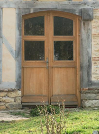 PORTE D'ENTREE DOUBLE A CINTRE SURBAISSEE.